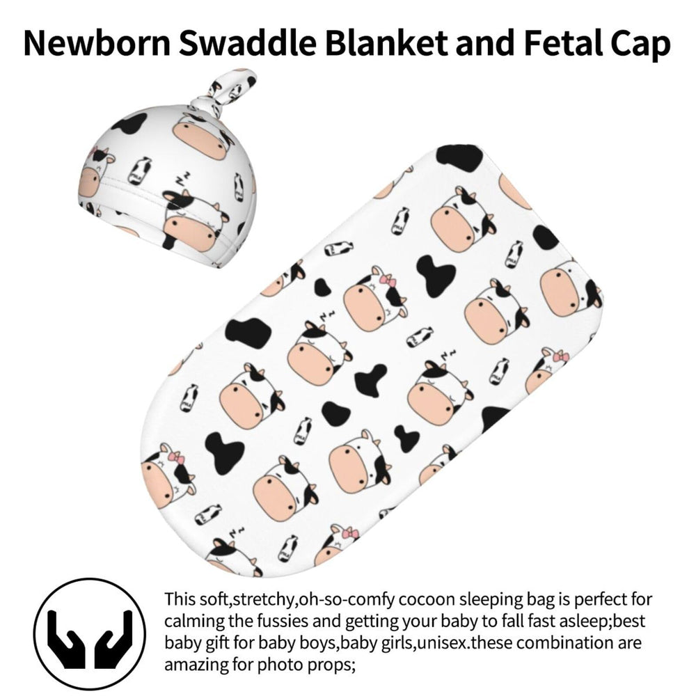 Lcokin cow-print swaddle hat set on tiny head for warm photos.