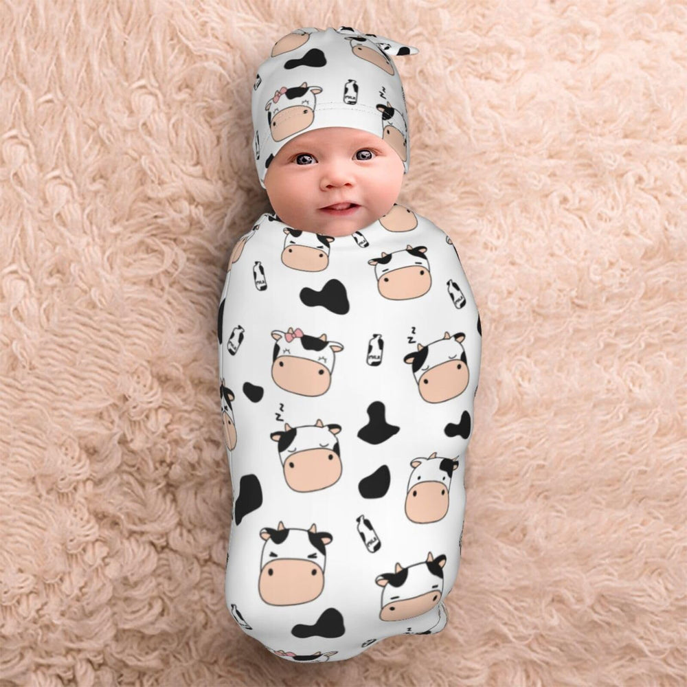 Lcokin newborn photography prop with cow-print swaddle ready for sessions.