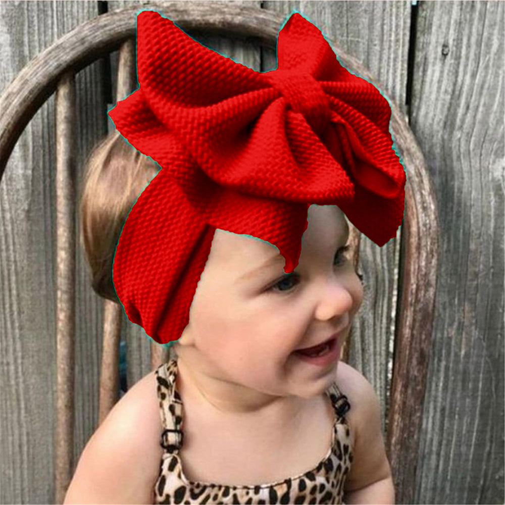 LDDCX red baby bows headband side view, comfortable stretch for 0-3 years.