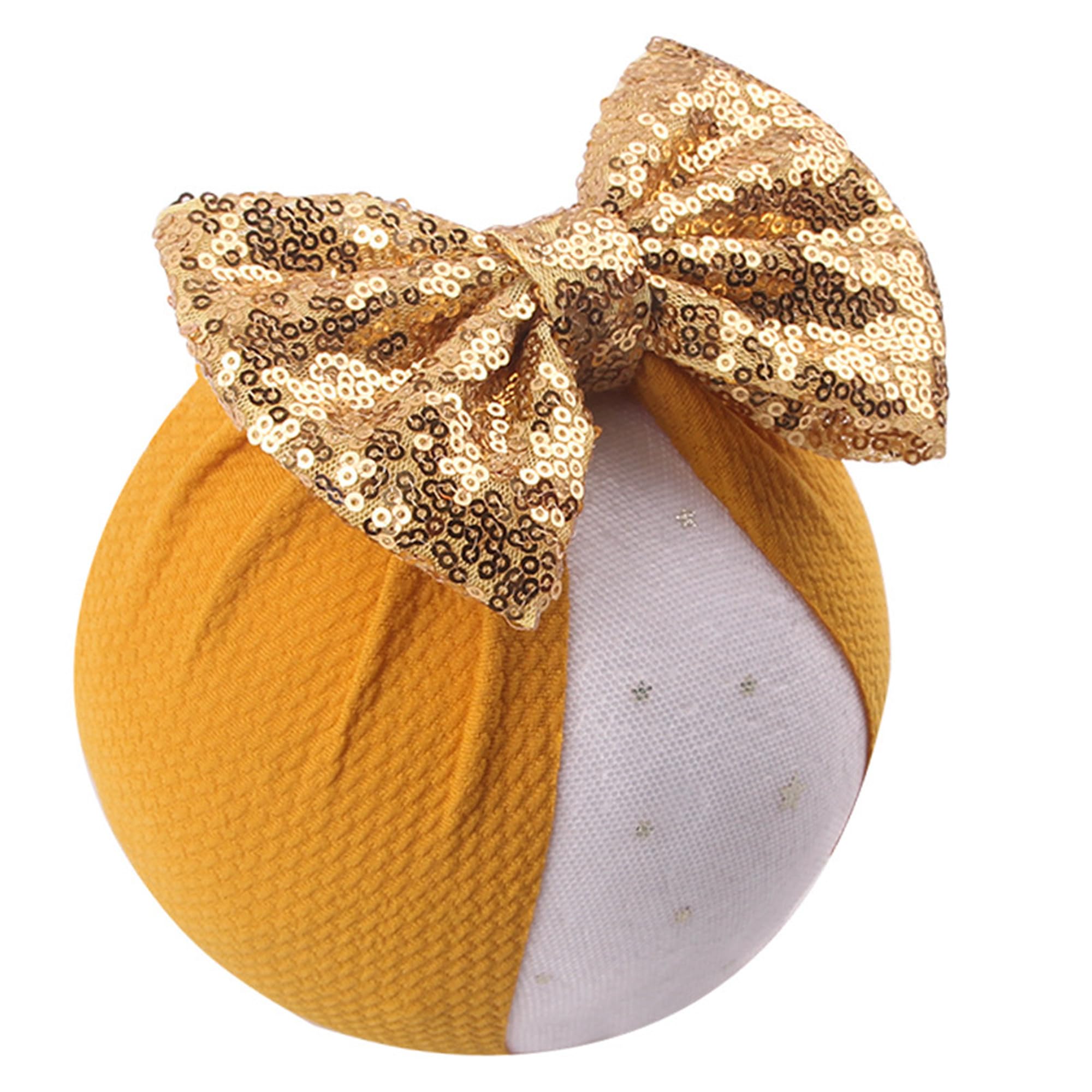 LDDCX glitter bows headband worn by babies, gentle stretch fits newborns to toddlers.