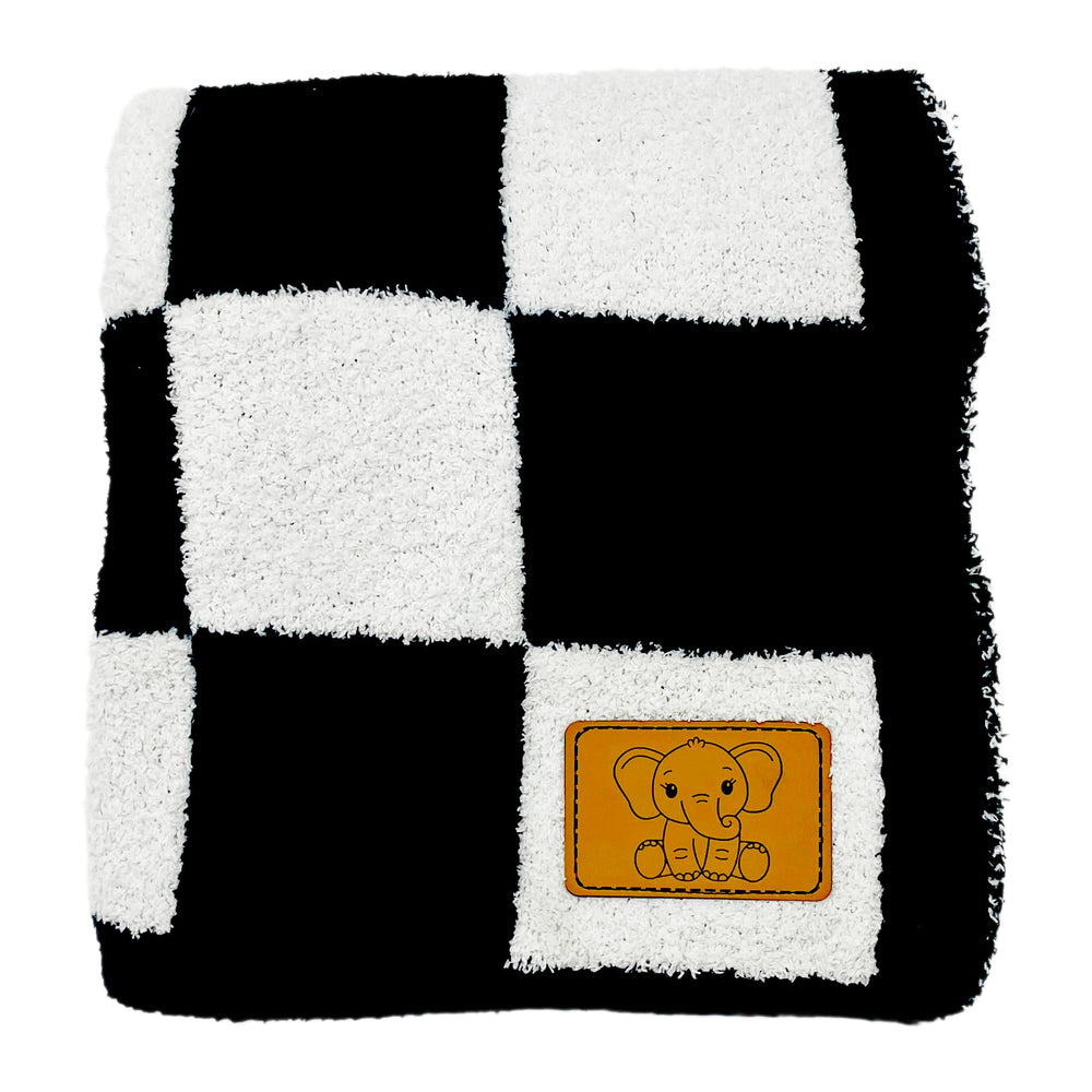 Leaps + Legends checkered blanket car seat use keeps baby cozy during rides