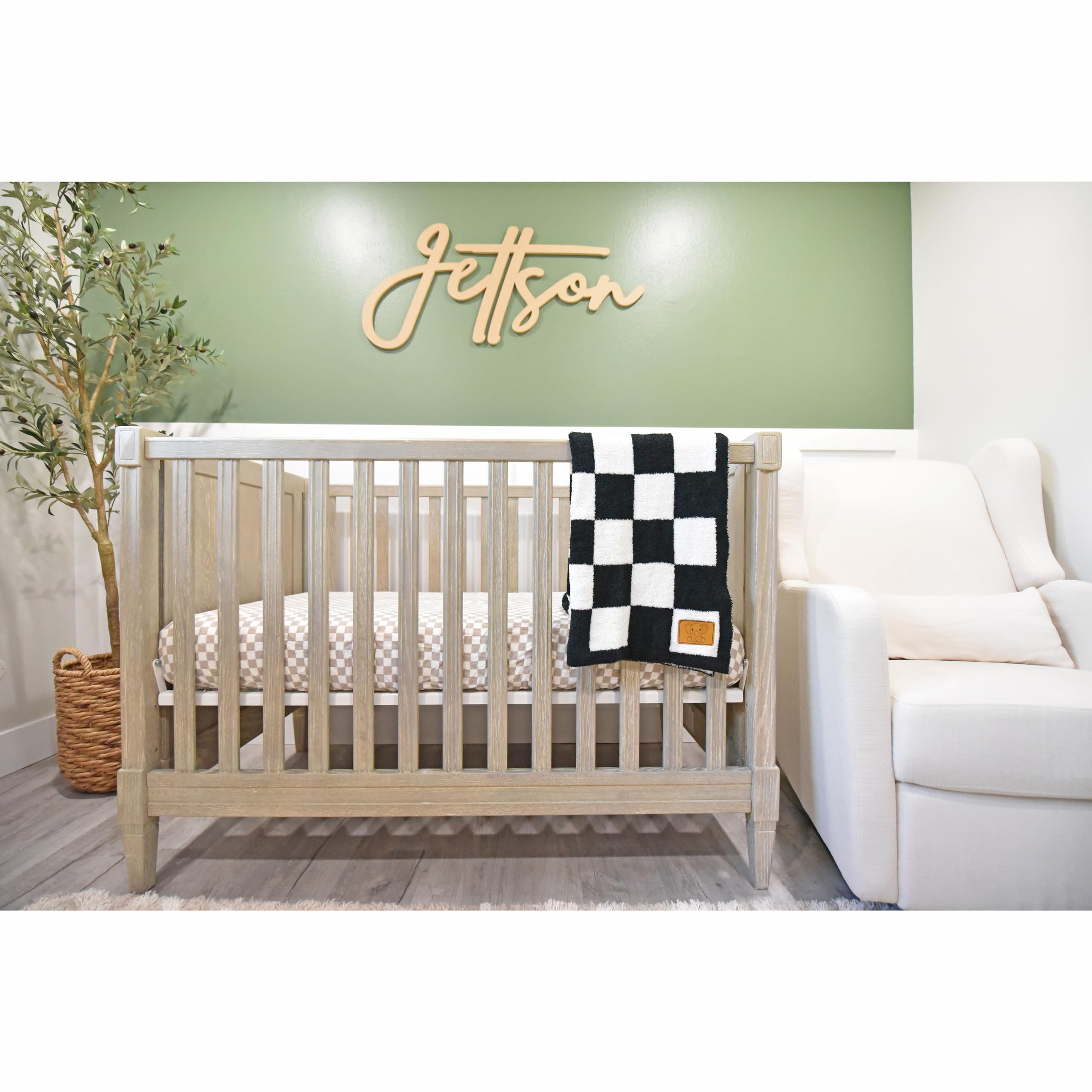 Leaps + Legends checkered blanket closeup shows ultra-soft fabric for cozy baby snuggles