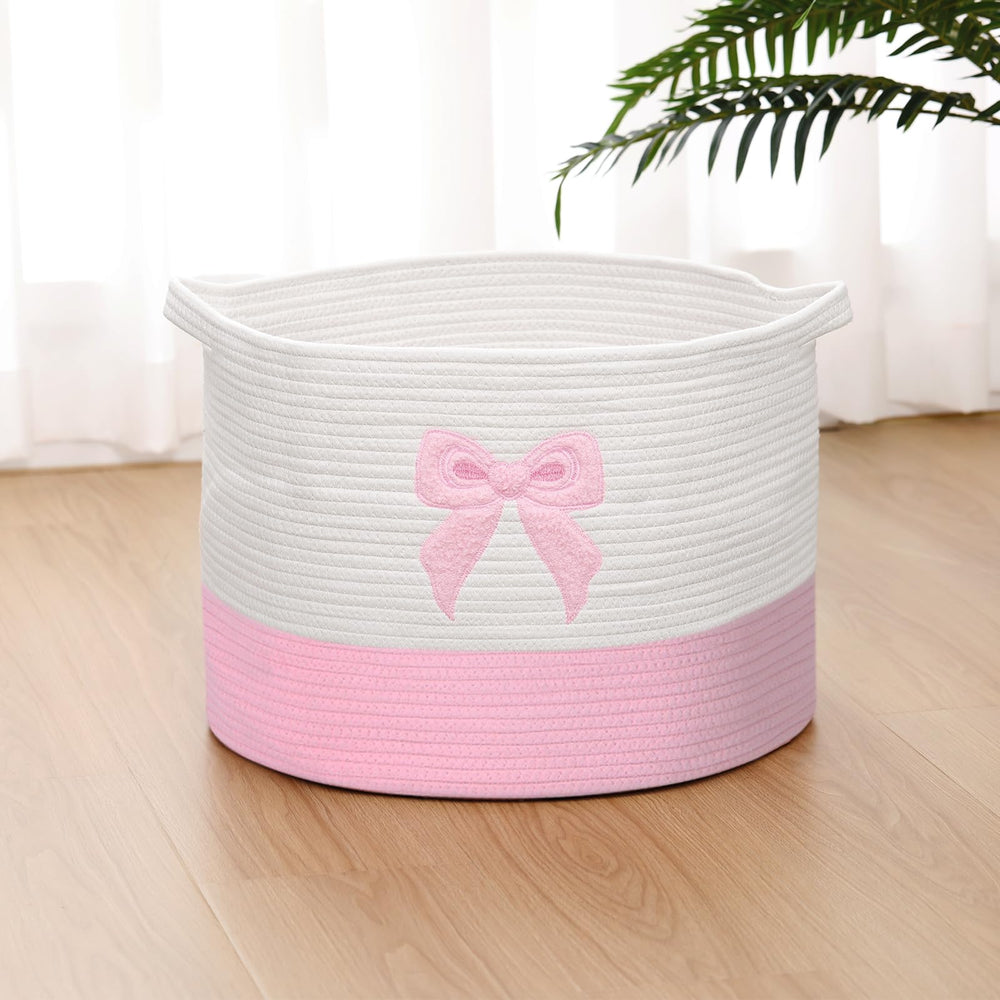 LemonRoad Pink Bow Extra Large Basket being used for baby laundry and towels.