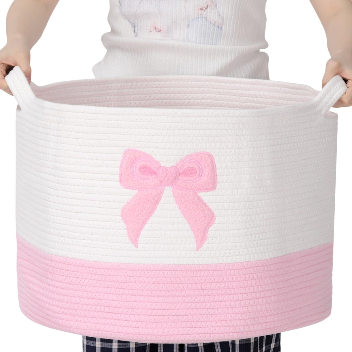 LemonRoad Pink Bow Extra Large Basket full of blankets for easy living room organization.