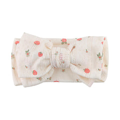 LemonSpace knotted double bows strawberry-print headband on newborn for everyday outfits.