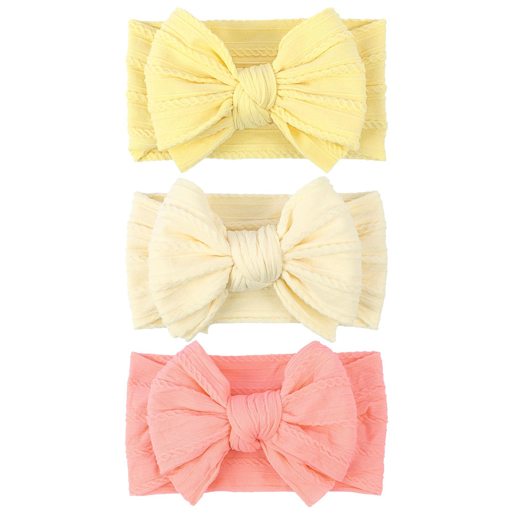 LemonSpace baby bow light yellow close-up showing soft stretch for gentle wear.
