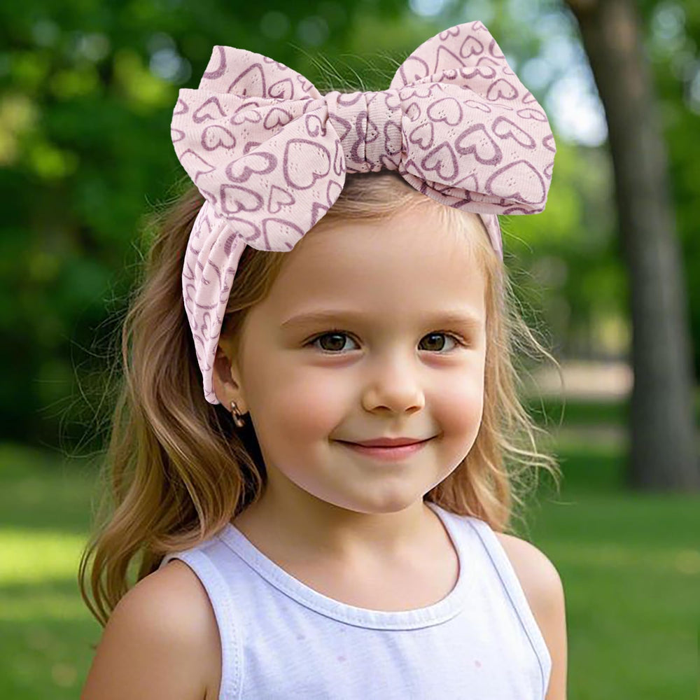 LemonSpace packaging presents a gift-ready heart-print headwrap for baby showers.