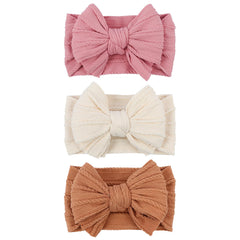 LemonSpace baby bow in pink close-up showing soft, breathable stretch for delicate skin.