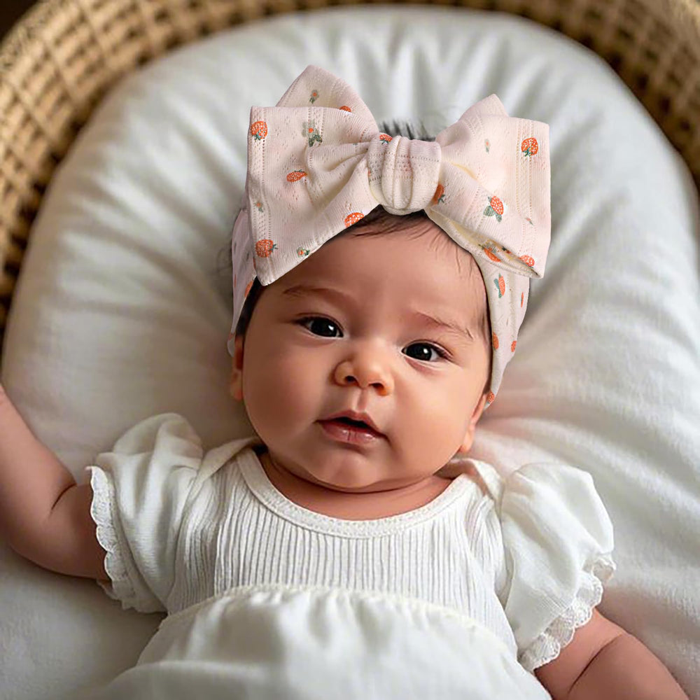 LemonSpace stretchy headband demonstrates one-size versatility for newborns to toddlers.