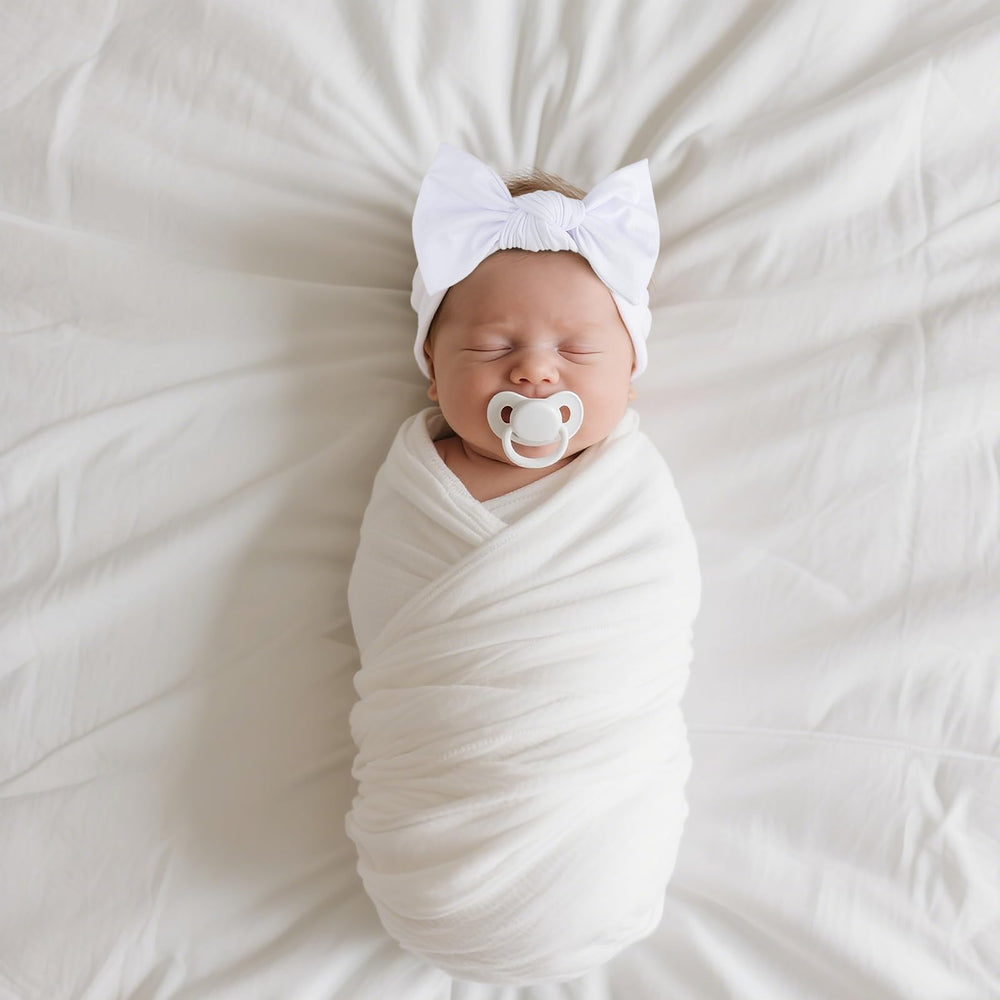 LemonSpace headwrap on newborn emphasizing gentle touch and breathable material.