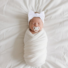 LemonSpace headwrap on newborn emphasizing gentle touch and breathable material.