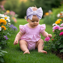 LemonSpace newborn headband fit demonstrates stretch and one-size design for growing babies.