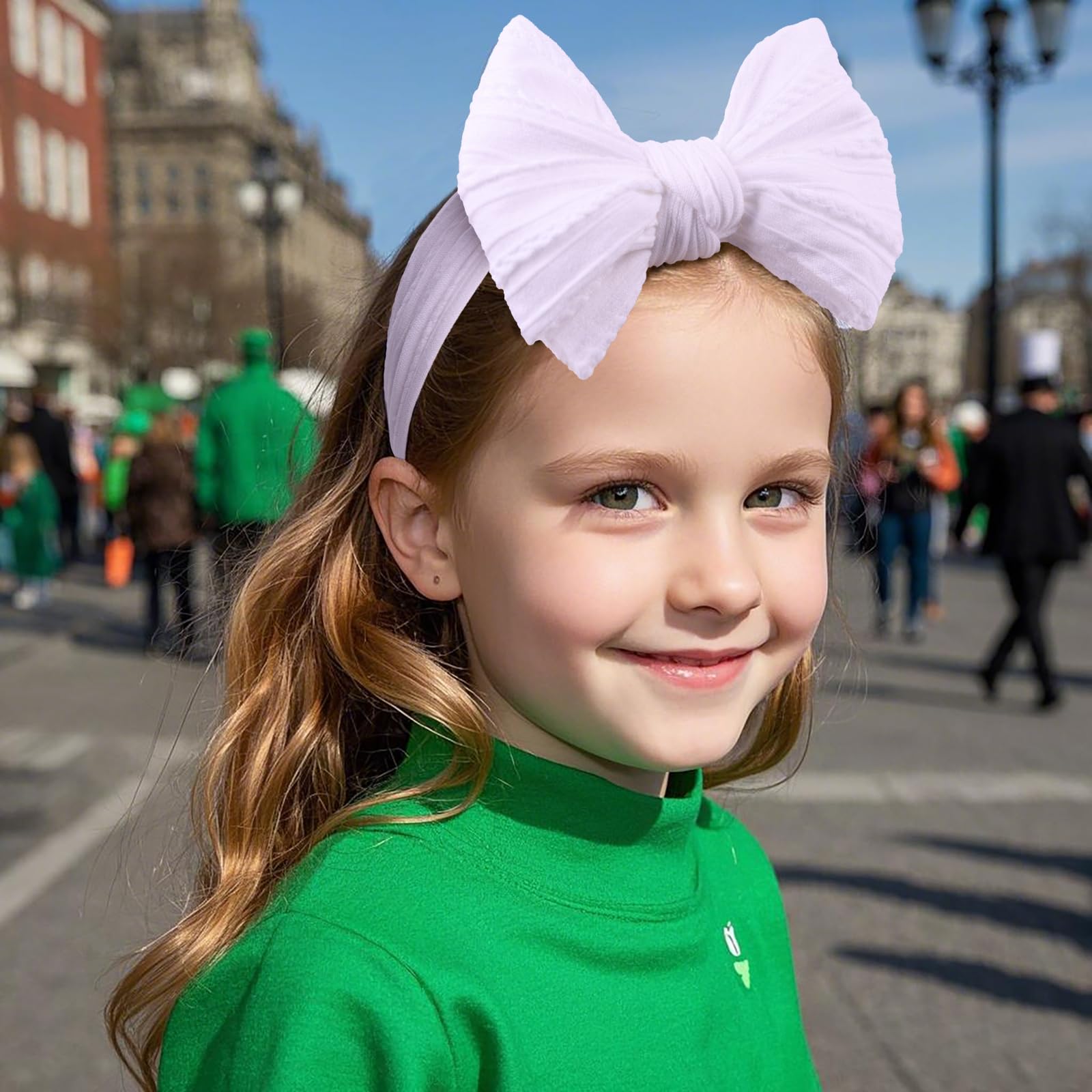 LemonSpace party headband green bow worn for outings and holiday celebrations.