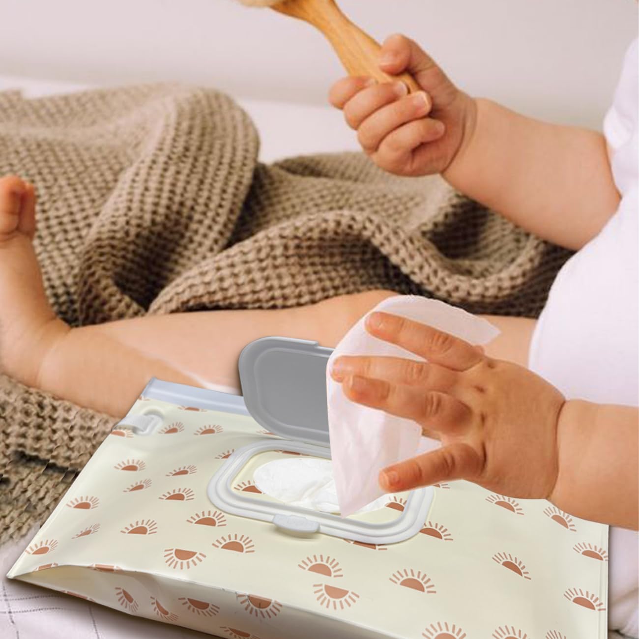 Lethooly wipe holder in use on a stroller showing portable design