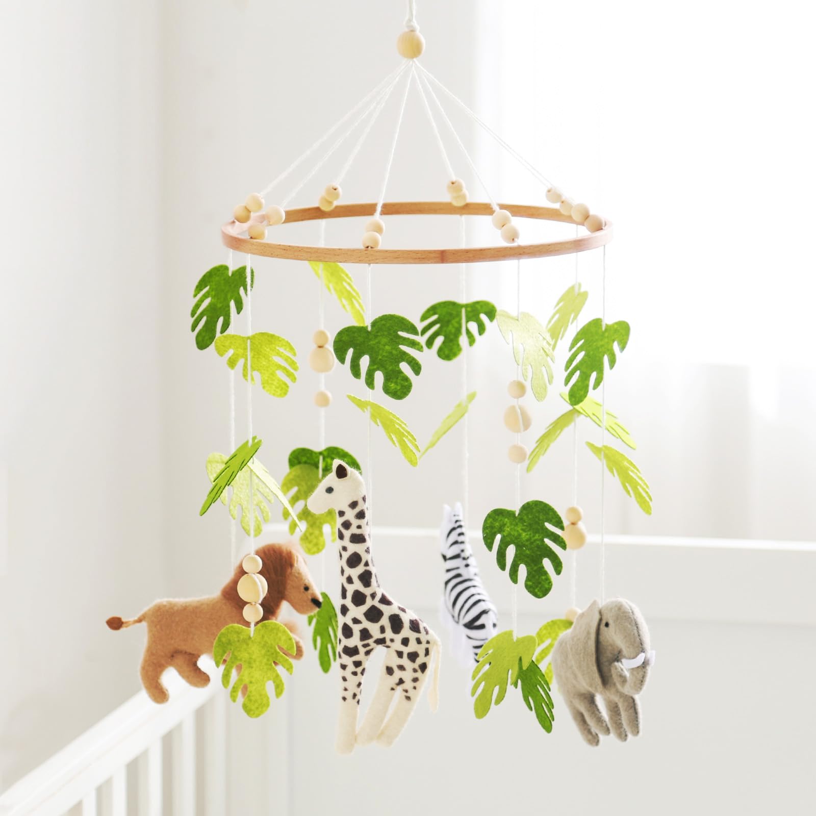 let's make baby mobile crib safari lion close-up for calm sleep