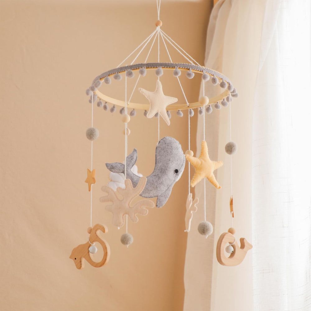lets-make crib mobile coral seahorse promotes visual tracking during nap time.