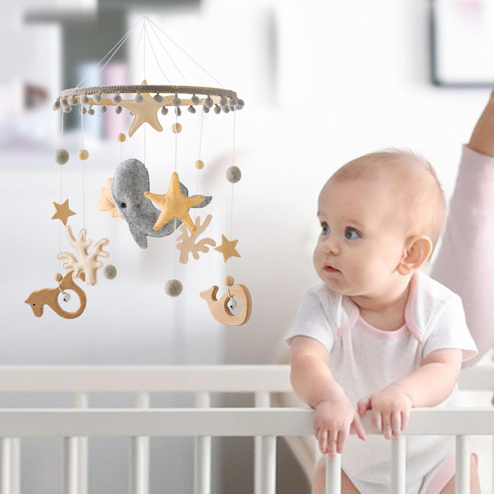 lets-make crib mobile gender-neutral colors suit any nursery design.