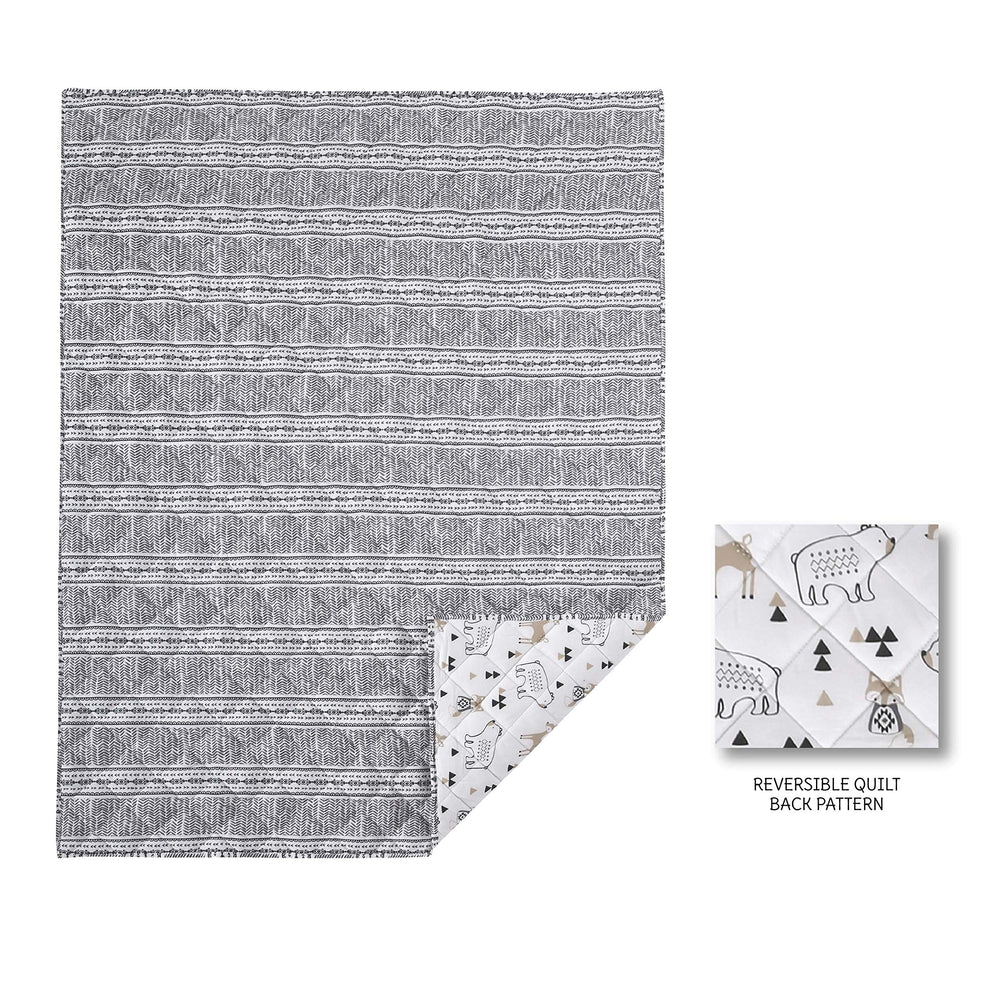 Levtex Baby Bailey Bear quilt on bed in neutral tones for versatile nursery decor.
