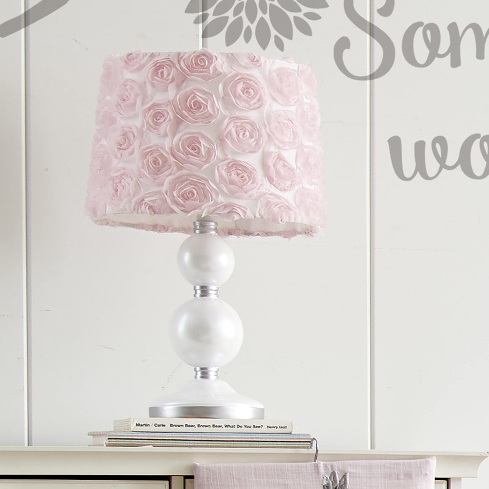 Levtex Baby Elise pink rosette shade adds decorative softness and calming ambiance.