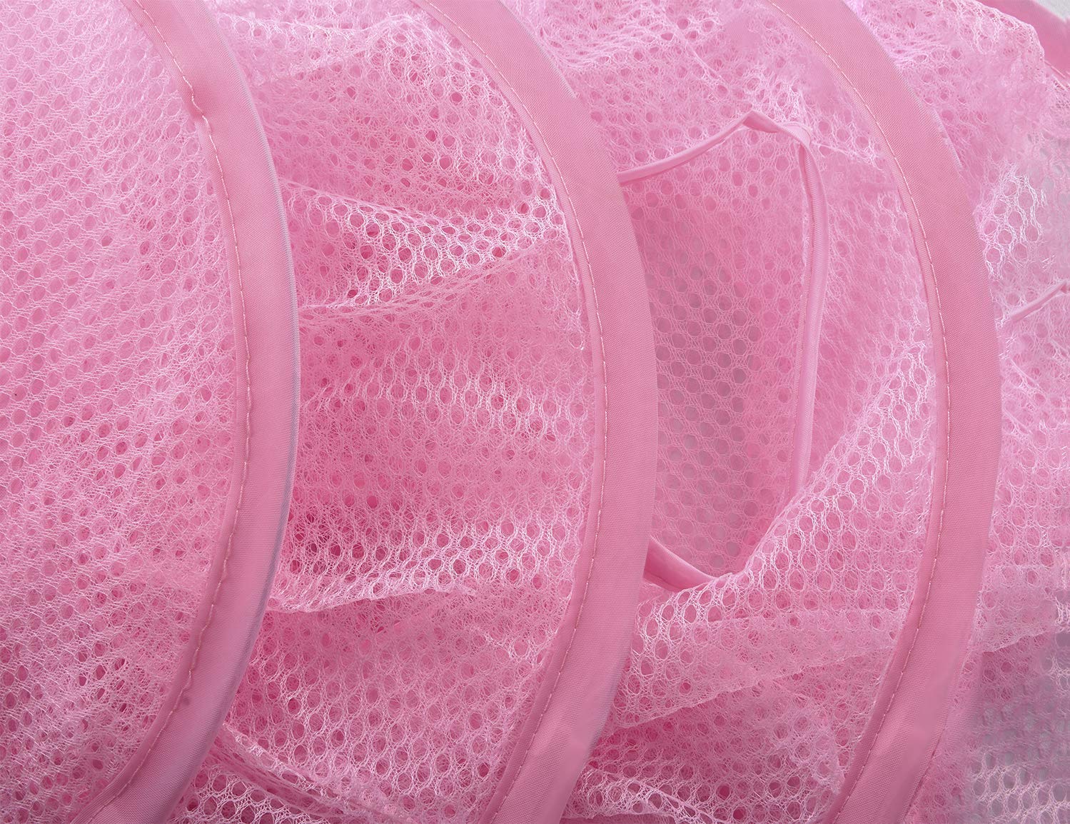 Libeder pink mesh storage in game room ready for small item storage.