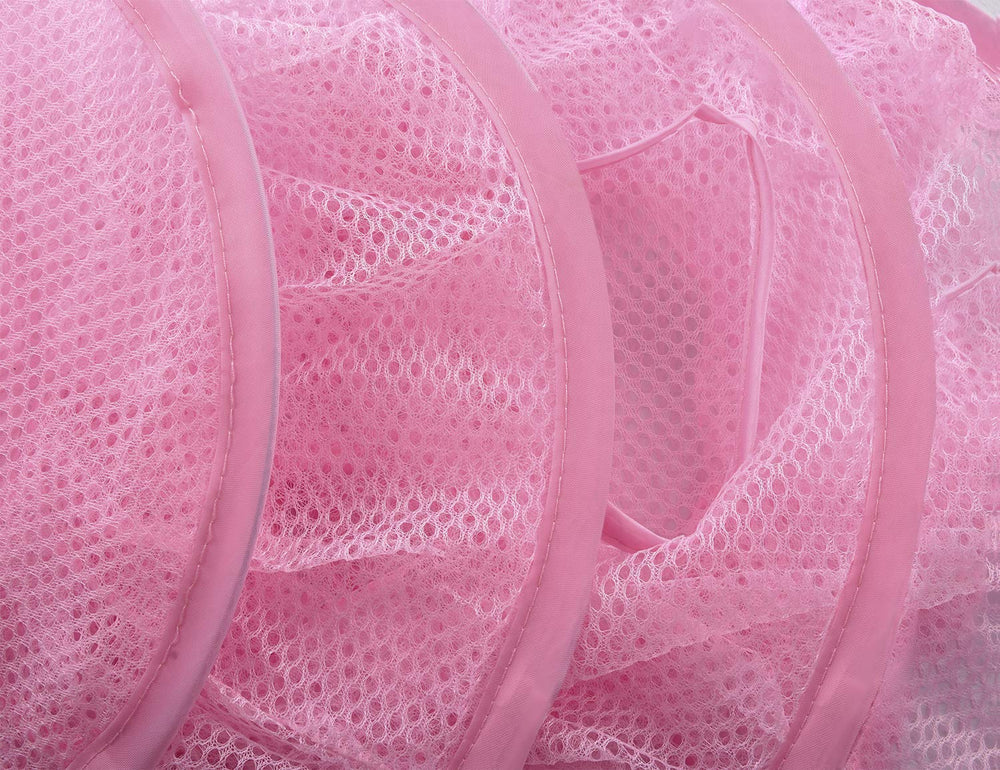 Libeder pink mesh storage in game room ready for small item storage.