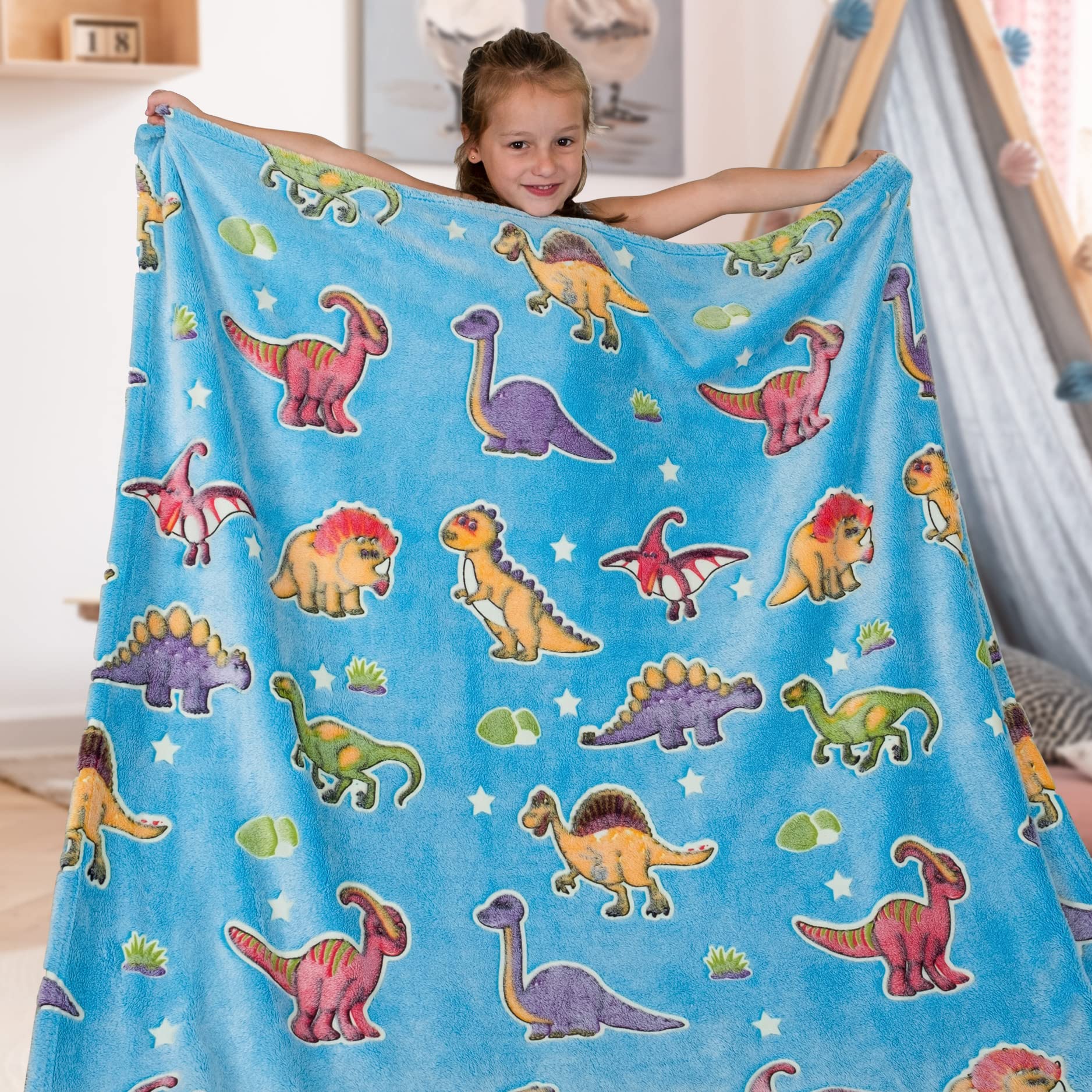 Liderstar dinosaur blanket on a couch for relaxed family movie night.