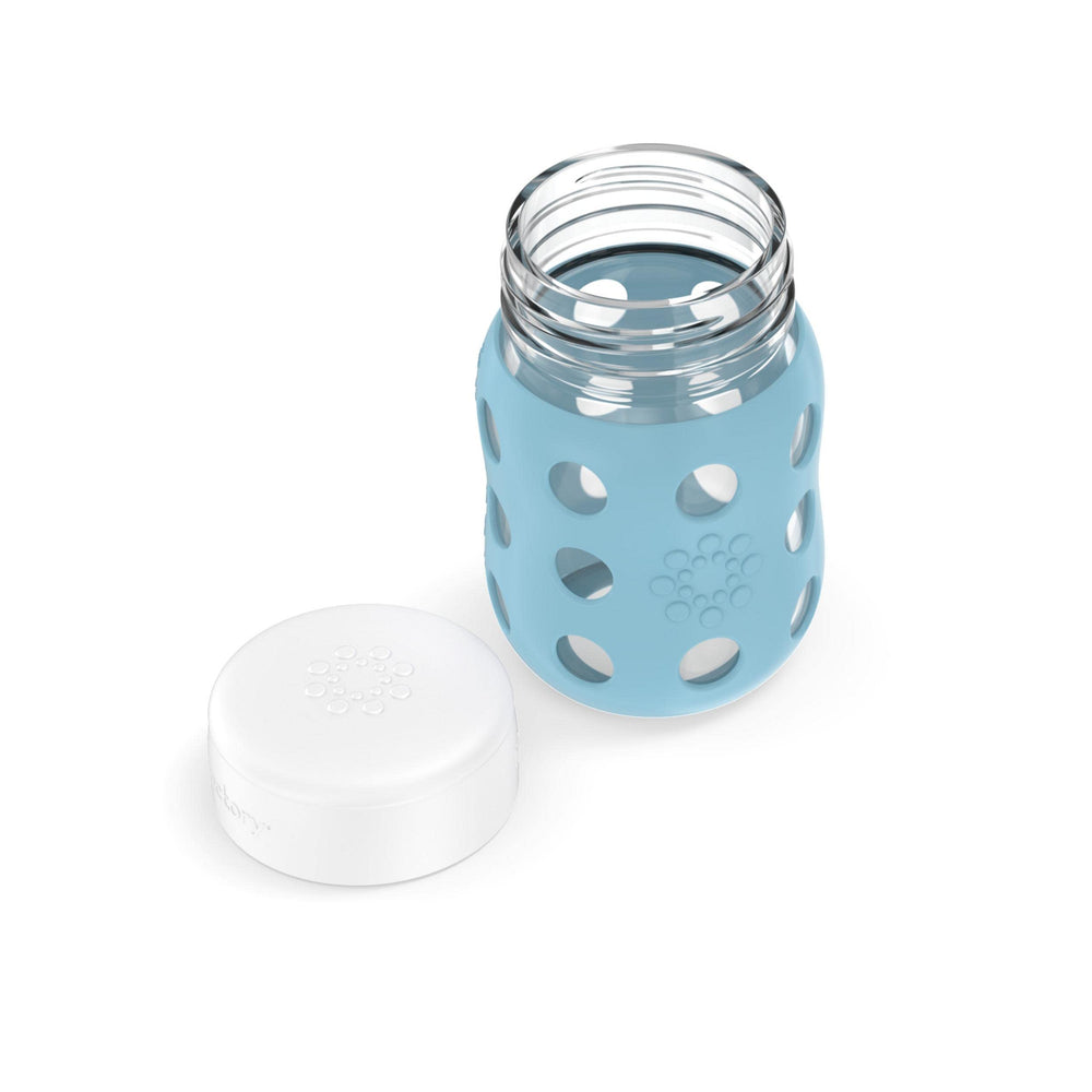 Lifefactory wide-neck bottle with silicone sleeve provides protected handling and grip.