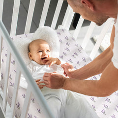 LifeTree crib sheets lavender pattern on crib mattress—secure fit with full elastic wrap.