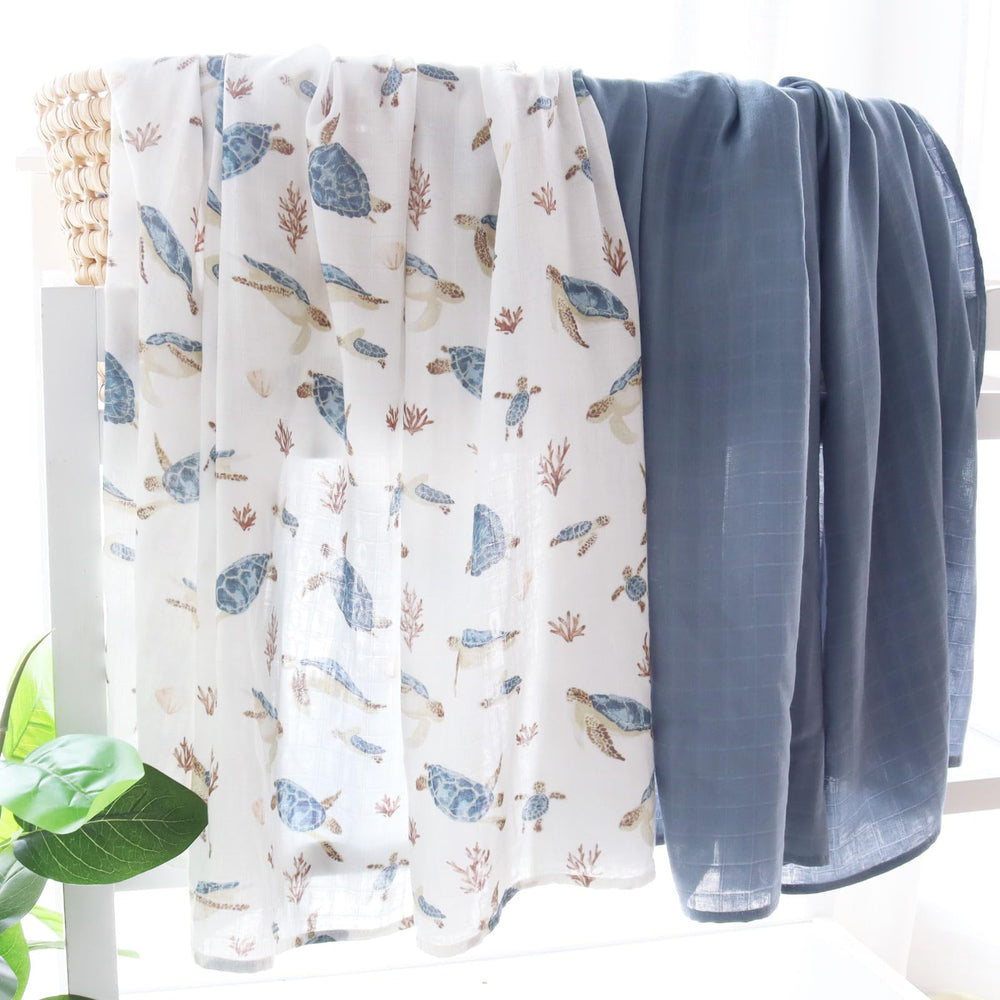 LifeTree muslin swaddle baby wrapped sea turtle highlights secure, comfortable wrap.