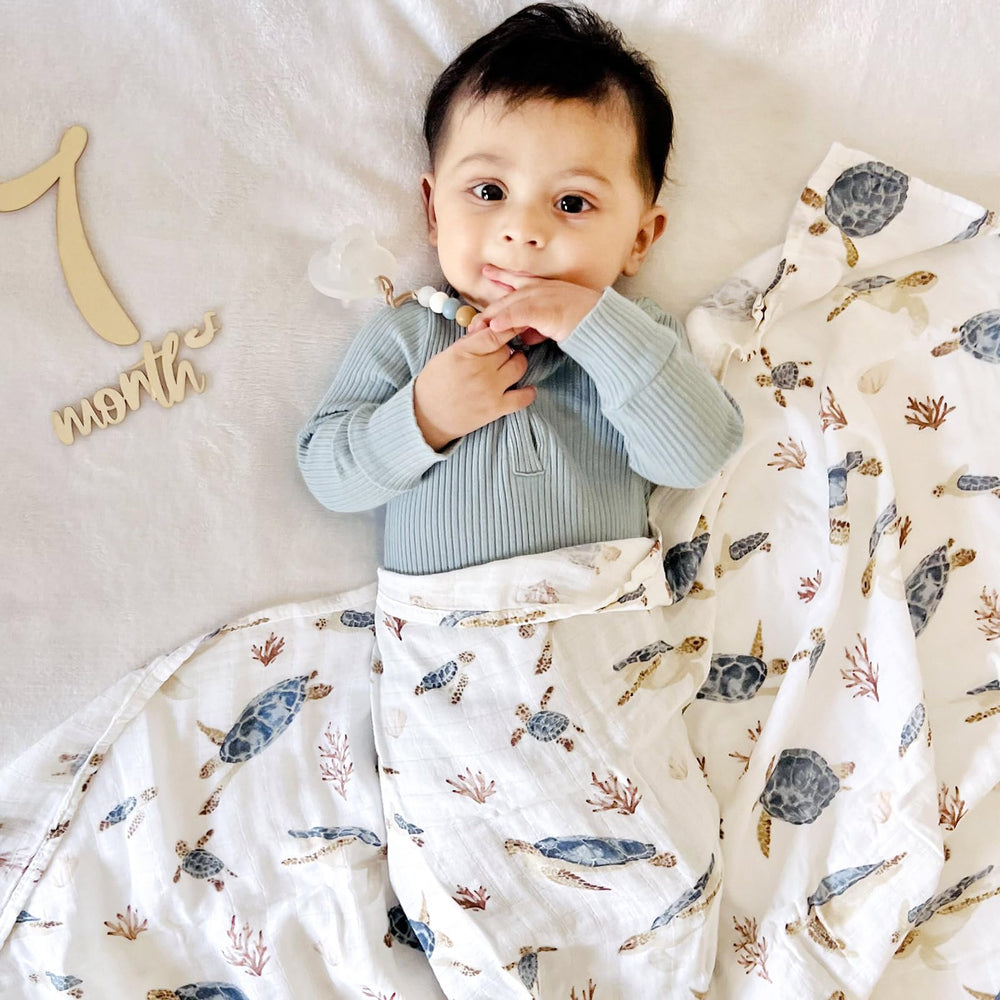 LifeTree muslin swaddle sea shells pattern provides cozy, breathable wrap for nap-time calm.
