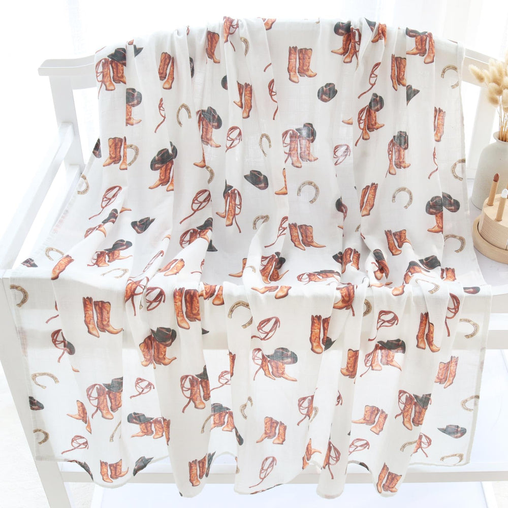 LifeTree muslin swaddle blanket care shot illustrates easy machine washing and durable daily use