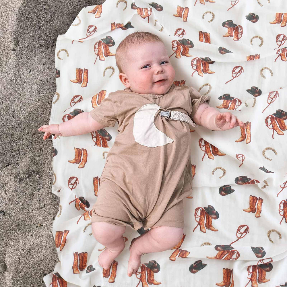 LifeTree muslin swaddle blanket western hat design highlights airy weave for gentle sleep support