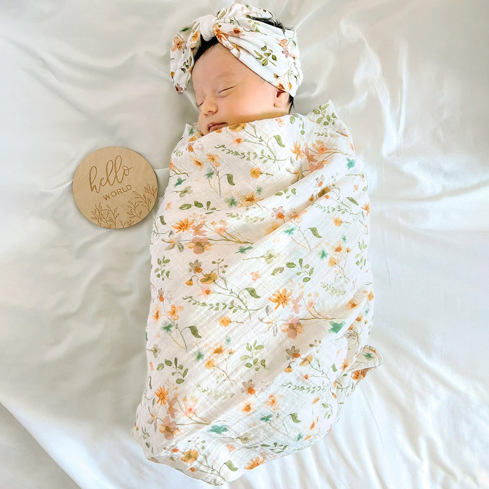 LifeTree newborn swaddle hat bow wildflower demonstrates gentle stretch for comfy wear.