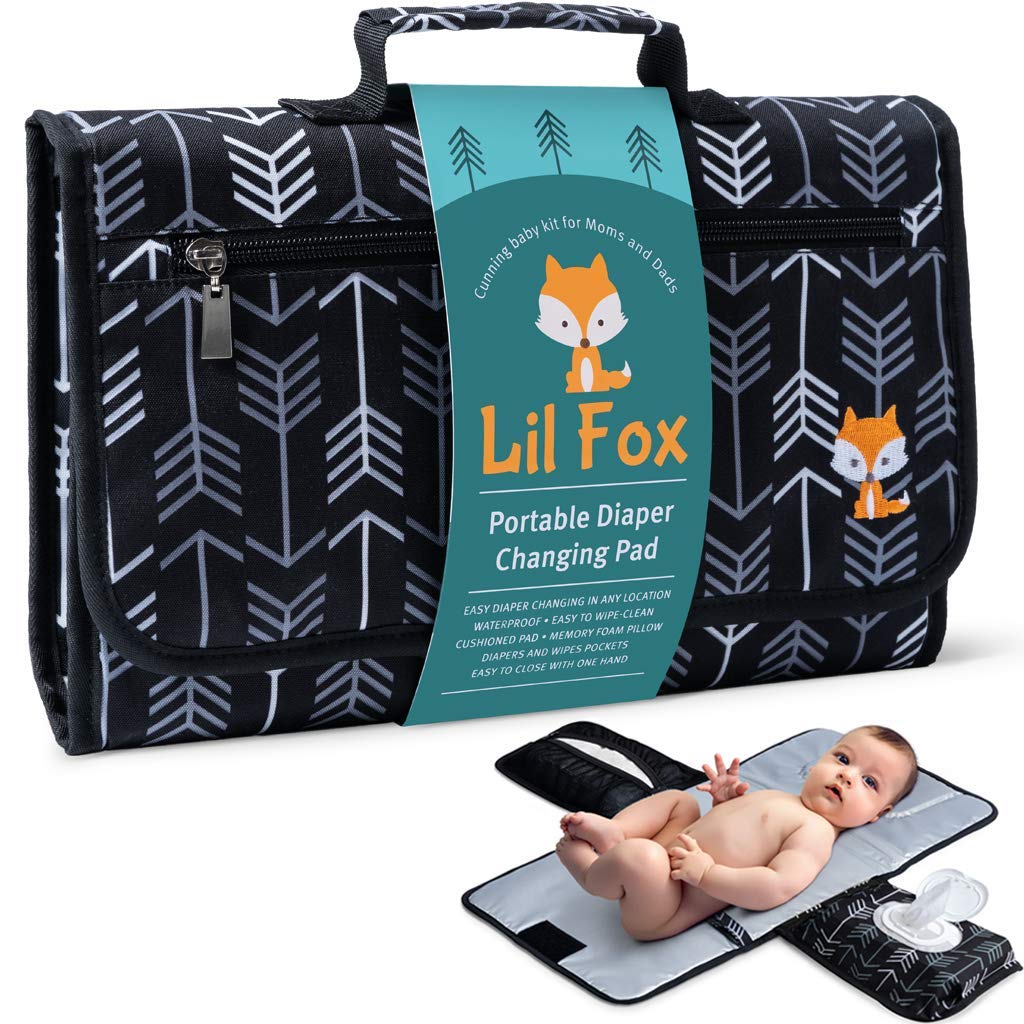 Lil Fox baby changing pad open demonstrates one-handed ease for quick diaper changes.
