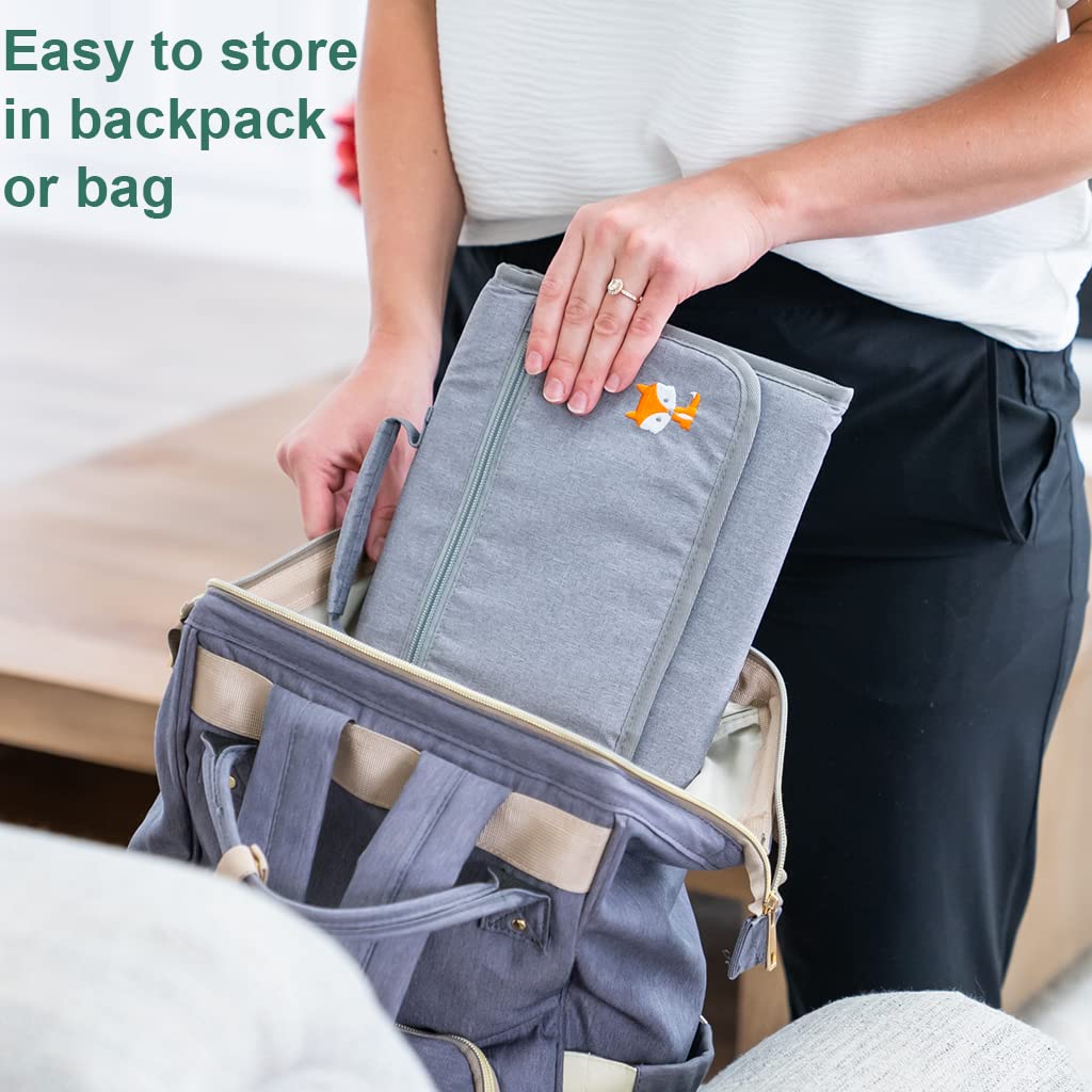 Lil Fox changing pad includes a diaper clutch strap for stroller attachment.