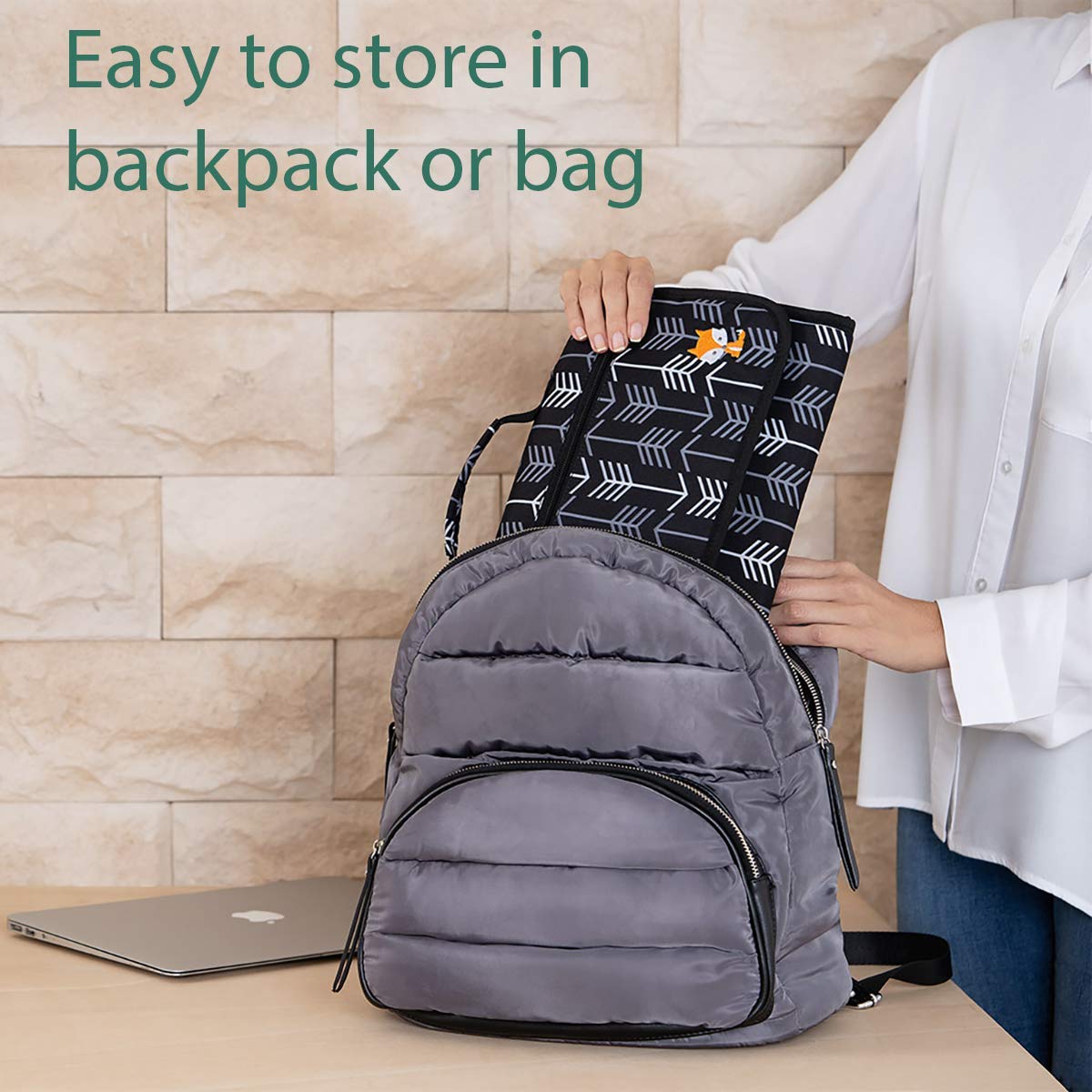 Lil Fox diaper clutch strap attaches to strollers for easy access.