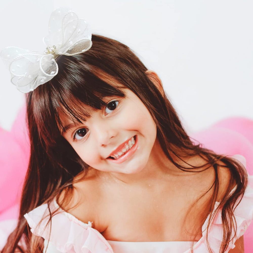Liliebe cream bows on model for flower girl look and elegance.