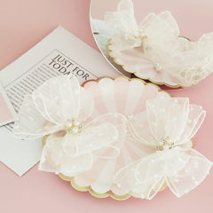 Liliebe pigtail bows detail highlights lightweight satin ribbon.
