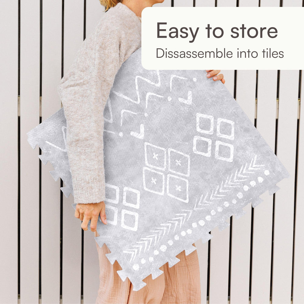 Lillefolk baby play mat gray padding helps protect tiny knees during playtime.