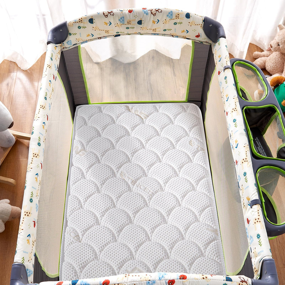 Lillibearas Pack N Play Topper edge detail highlights rounded corners for a snug fit.