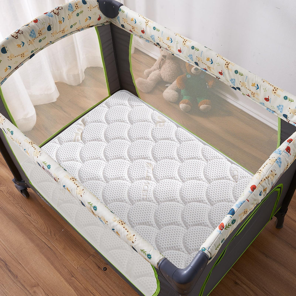 Lillibearas Pack N Play Topper fit-no-gaps view across playard corners.