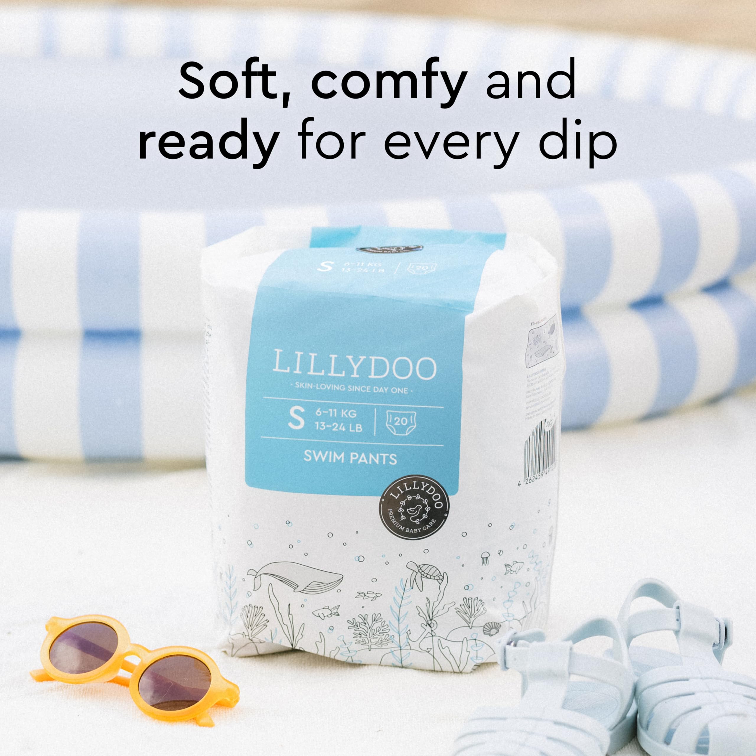 LILLYDOO Blue Whales swim diapers worn by a baby during pool time
