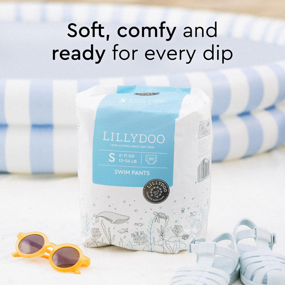 LILLYDOO Blue Whales swim diapers worn by a baby during pool time