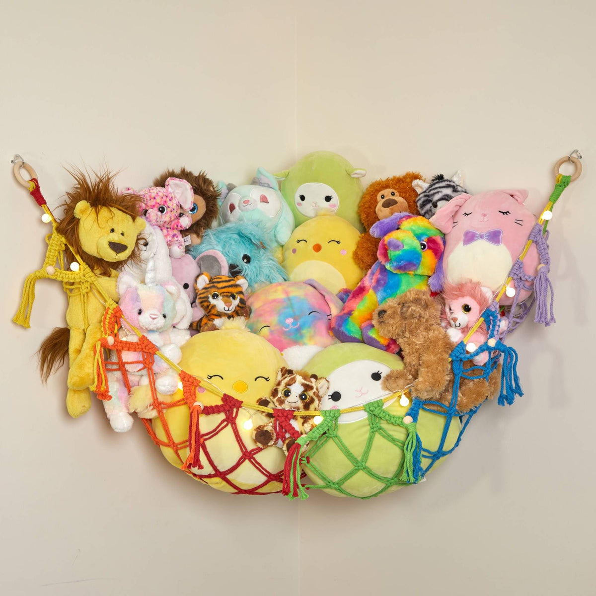Lilly's Love stuffed-animal storage macrame hammock (large rainbow) helps declutter toys.