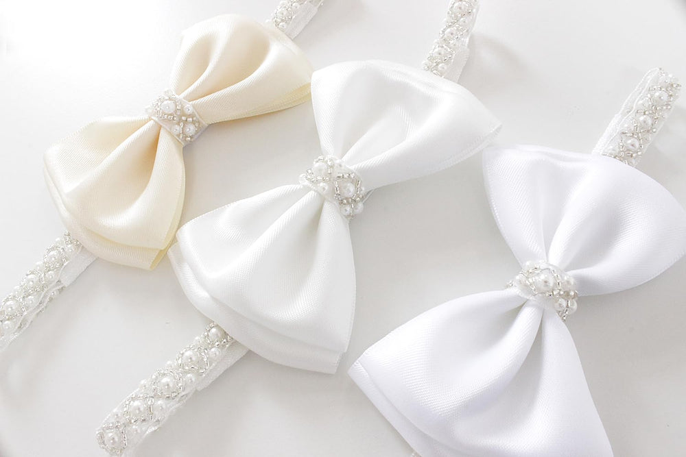 LilPinkGoose newborn headband pairs with white outfits for cohesive looks.
