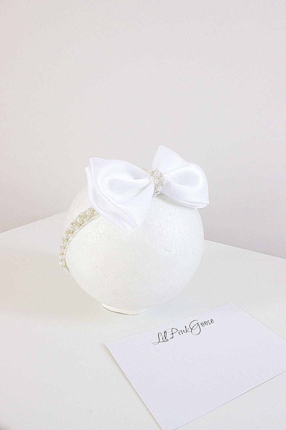 LilPinkGoose headband on baby in white outfits for christening moments.