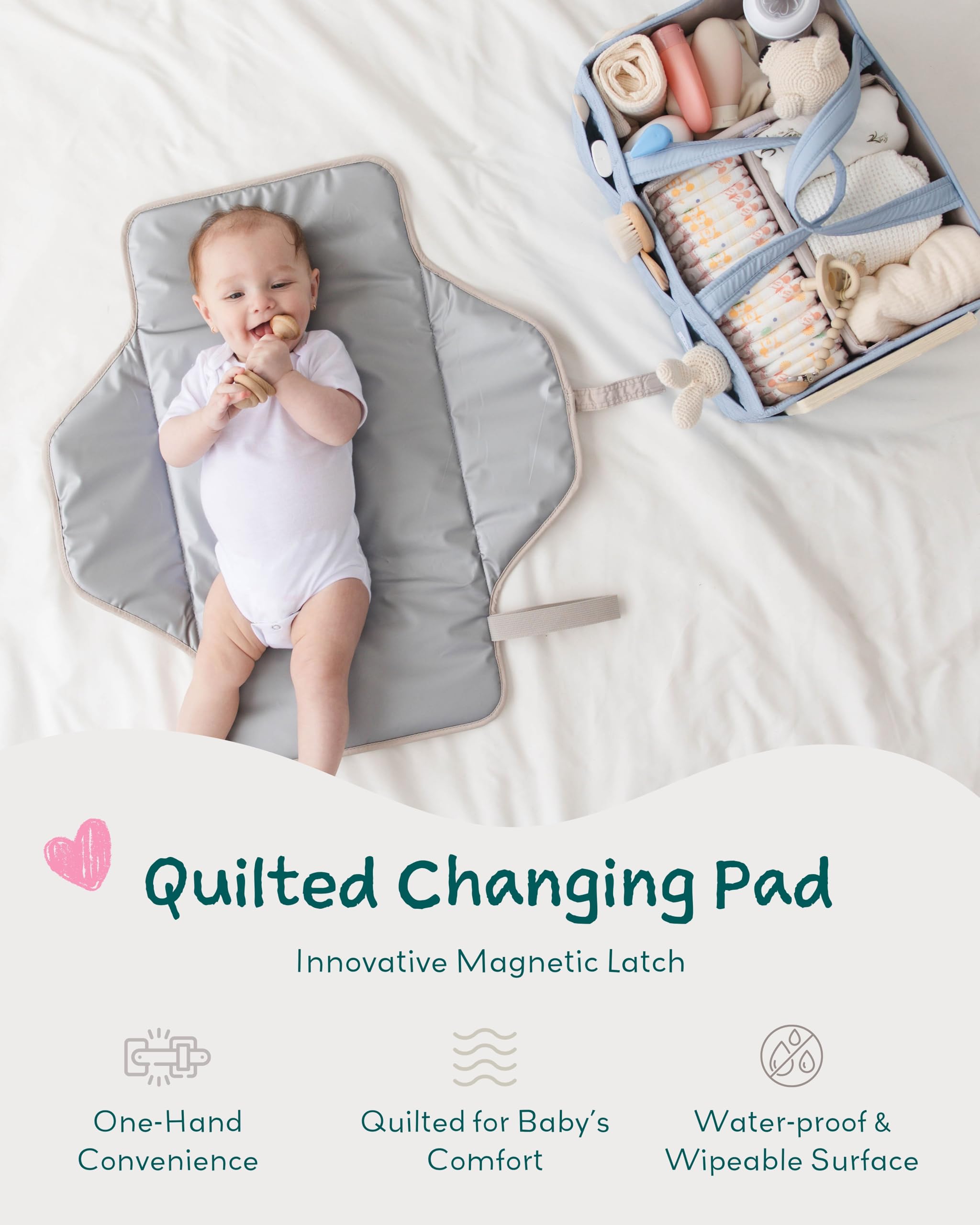 Lily Miles baby changing pad magnetic latches close-up for snag-free one-handed use.