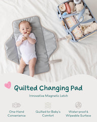 Lily Miles baby changing pad magnetic latches close-up for snag-free one-handed use.