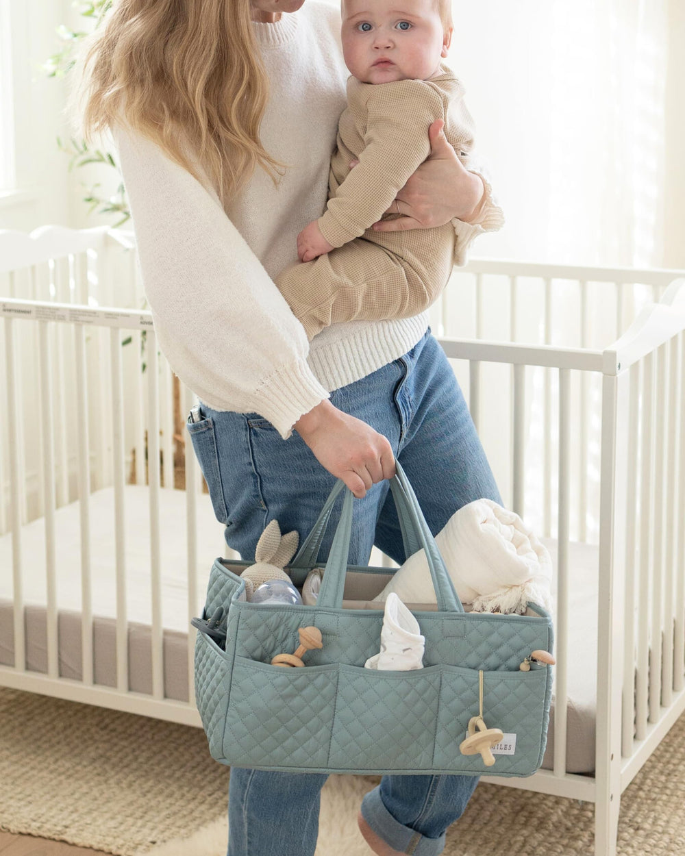 Lily Miles willow green color complements modern nurseries and gift-worthy presentation.