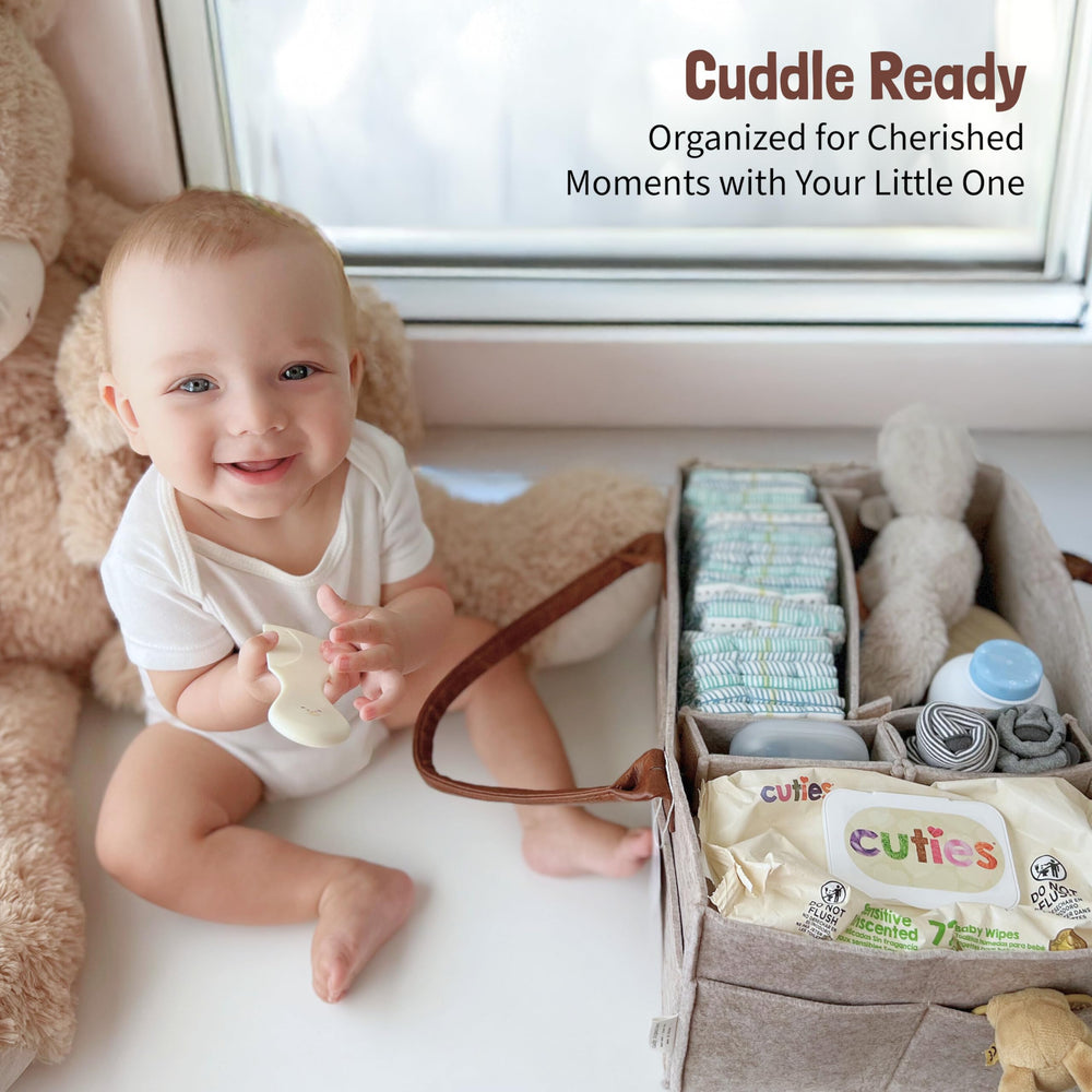 Lily Miles diaper caddy organizer in car suggests easy access to diapers and wipes on trips.